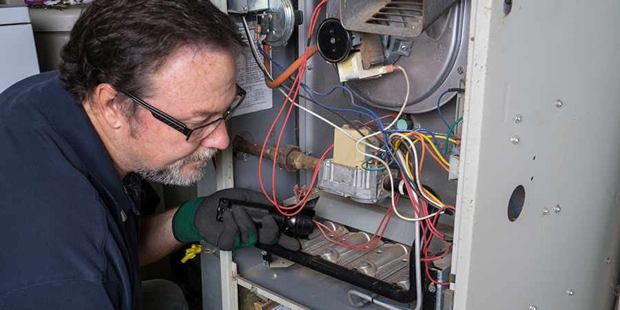 technician working on heating repair