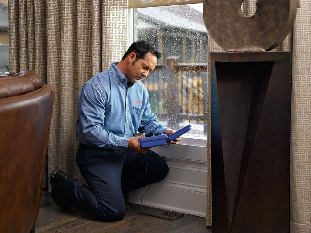 Trane technician checking vent