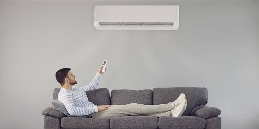 Person turning on ductless unit